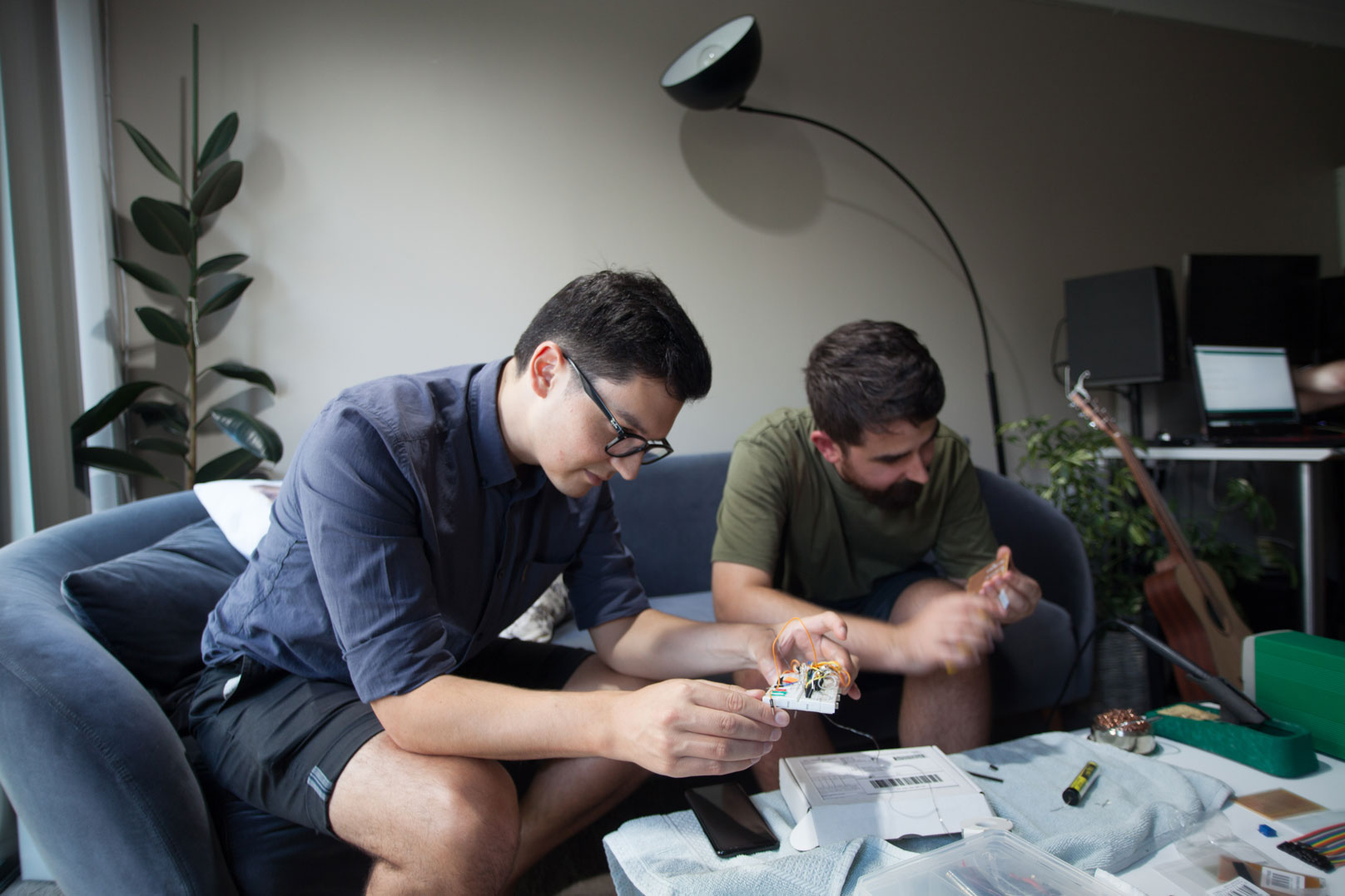 Levi Patel and Chris Pratt working on robotics circuits