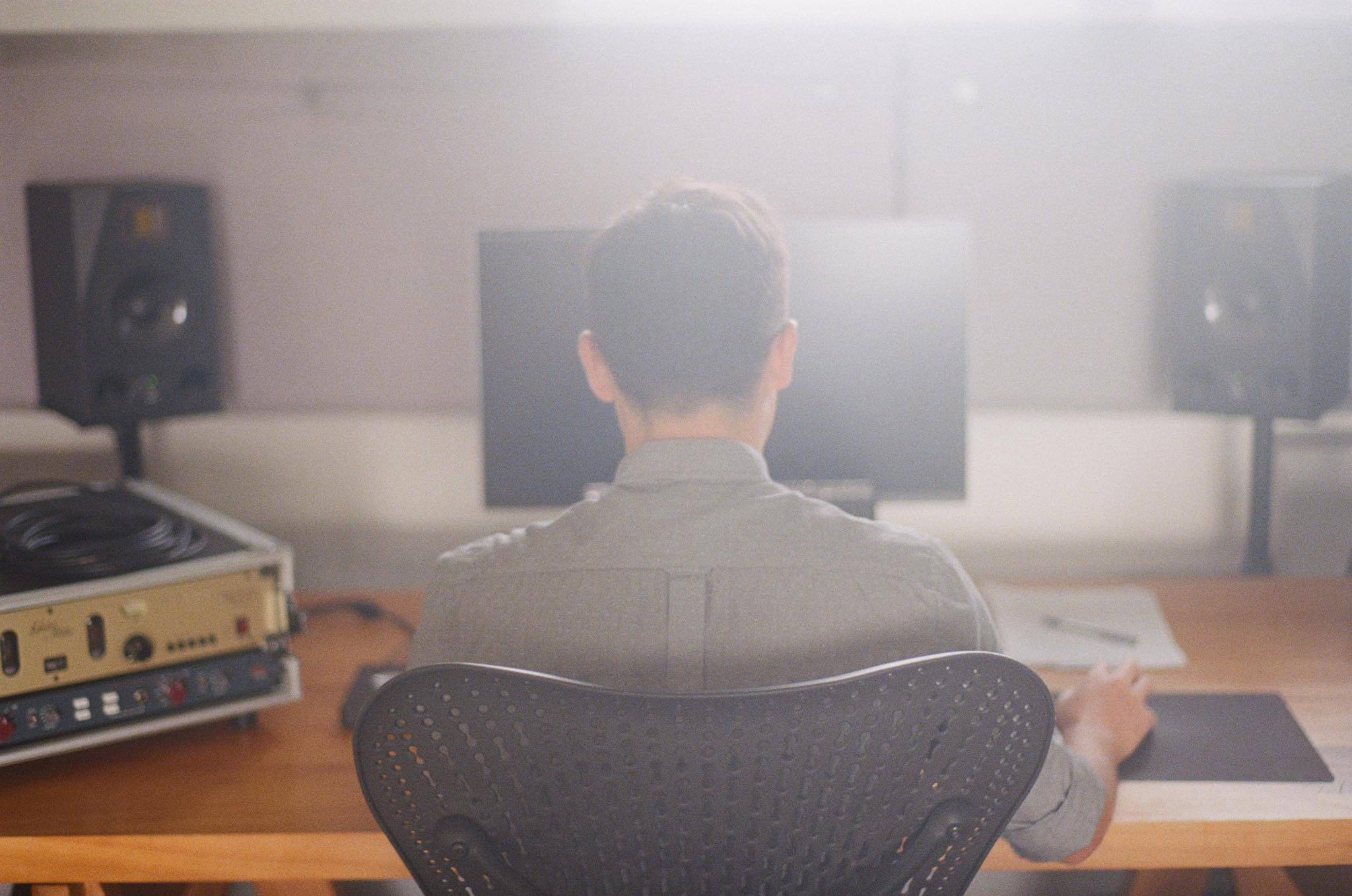 Levi Patel working at recording studio desk